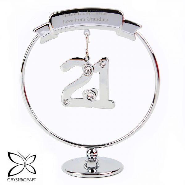Mark their 21st Birthday with this elegant Crystocraft ornament. Dangling from a personalised round silver stand, is a crystal clad 21